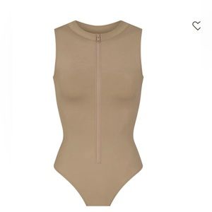 SKIMS zip front sleeveless one piece.